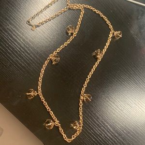 Stella and dot long gold chair with champagne jewlels